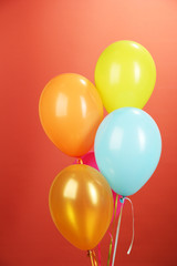 colorful balloons on red background