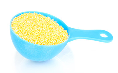 Measuring spoon with grain isolated on white