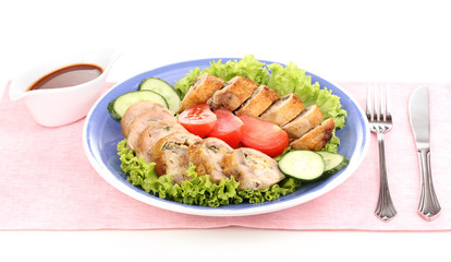 Tasty meat cutlet with garnish on plate isolated on white