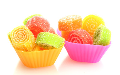 sweet jelly candies in cup cake cases isolated on white.
