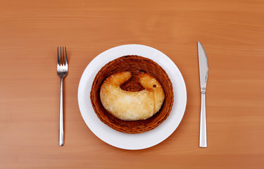 Fresh crossant on white plate