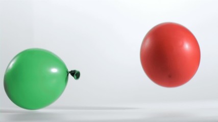 Two balloons rebounding in super slow motion - Powered by Adobe