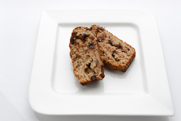 Slices of delicious banana bread on a white plate