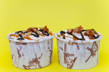 Cub cake chocolate on yellow background