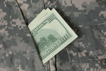 Dollars in army uniform pocket