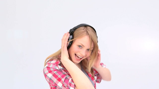 Woman dancing while she is listening to music