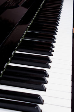 Piano keys side view with shallow depth of field