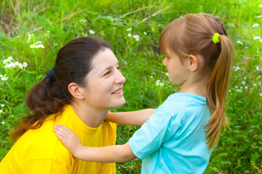 Smiling young mother has  good time with daughter