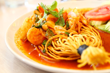 Tom Yam Koong and Squid soup with noodles :Thai cuisine