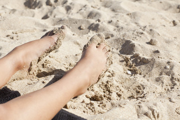 thins legs in the sand