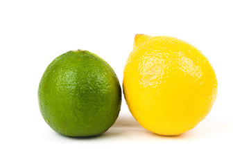 Closeup of lemon and lime citrus fruits over white