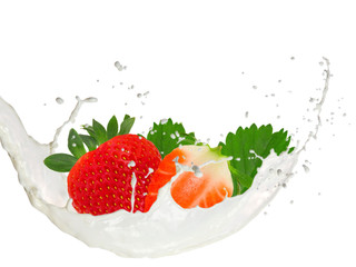 Milk splash with strawberries isolated on white