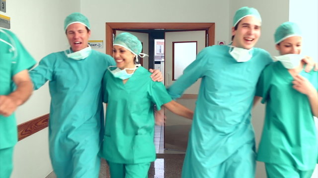 Surgery team leaving the operating room