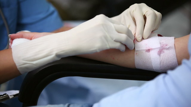 Nurse practicing a transfusion on a patient