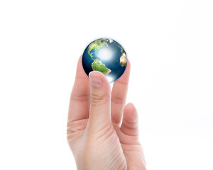 Hands with earth (Elements of this image furnished by NASA)