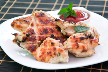 Chicken wings on a grill 