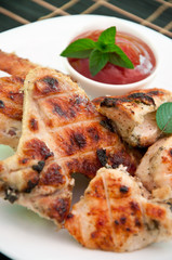 Chicken wings on a grill 