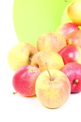 Fresh green, red apples in basket isolated