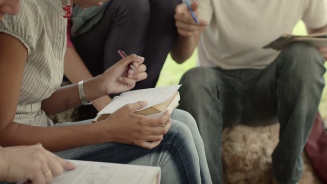 People and education, college students doing homeworks in park