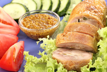 Tasty meat cutlet with garnish on plate close-up