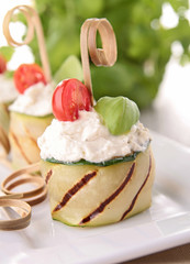 grilled zucchini with cheese ,tomato and basil