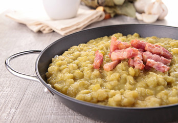 bowl of split pea soup and bacon