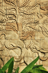 Fototapeta na wymiar stucco carved wall depicting elephants