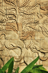 stucco carved wall depicting elephants