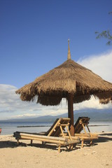 Sun chairs and umbrella on a beach
