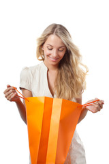 blonde woman holding shopping bags