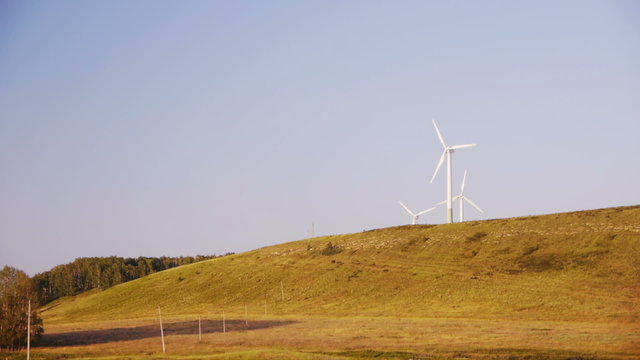 Wind turbines generating electricity at autumn