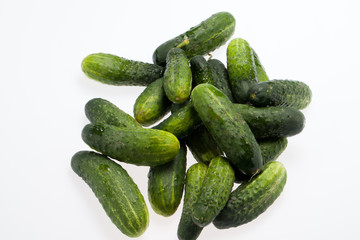 A fresh green cucumber isolated on a white background