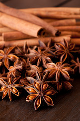 Star anise and cinnamon close up on wooden table