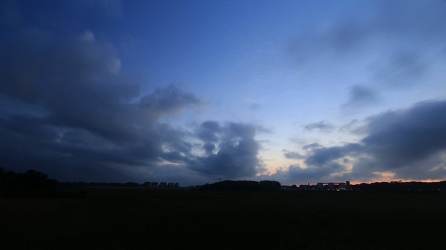 Landscape with fast moving clouds - Time Lapse