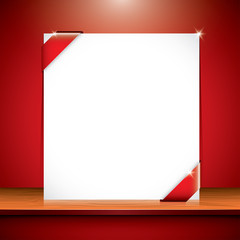 blank card with red ribbon on the shelf
