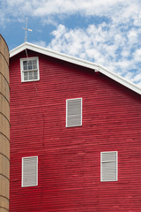 Traditional US red painted barn on farm