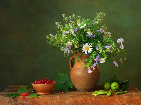Still life with wildflowers and red currants
