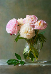 Bouquet of peonies in a glass jar