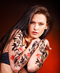 Young woman with body art .