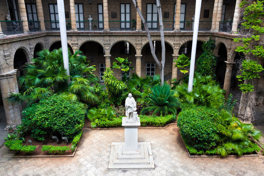 Spanish colonial palace in Havana with a statue of Columbus