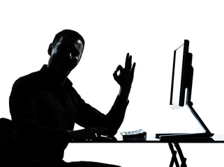 one business man silhouette computer computing ok gesture