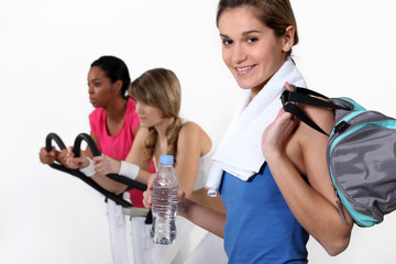 female trio in fitness center