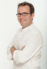 Male portrait with glasses arms crossed