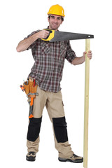 A carpenter with a handsaw.