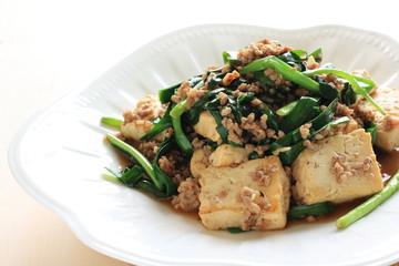 Chinese cuisine, Tofu and mince stir fried on white background