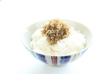 small sardines and seaweed on rice