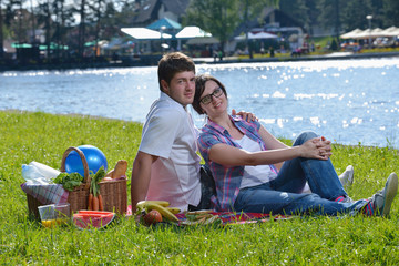 happy young couple having a picnic outdoor