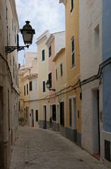 Fototapeta premium Street with colorful houses in old town of Ciutadella - Minorca