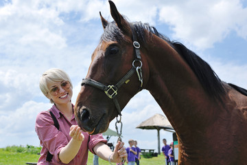 Obraz premium happy woman on horse