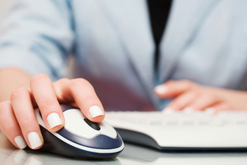 Female hand holding computer mouse